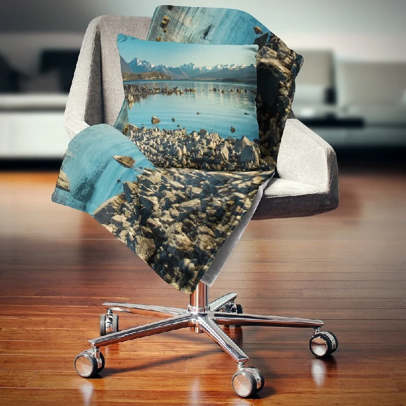 Chenille blankets with a thick and fuzzy textureChenille blankets with a thick and fuzzy textureDesignart 'Blue Waters in Rocky Beach Panorama' Landscape Fleece Throw Blanket
