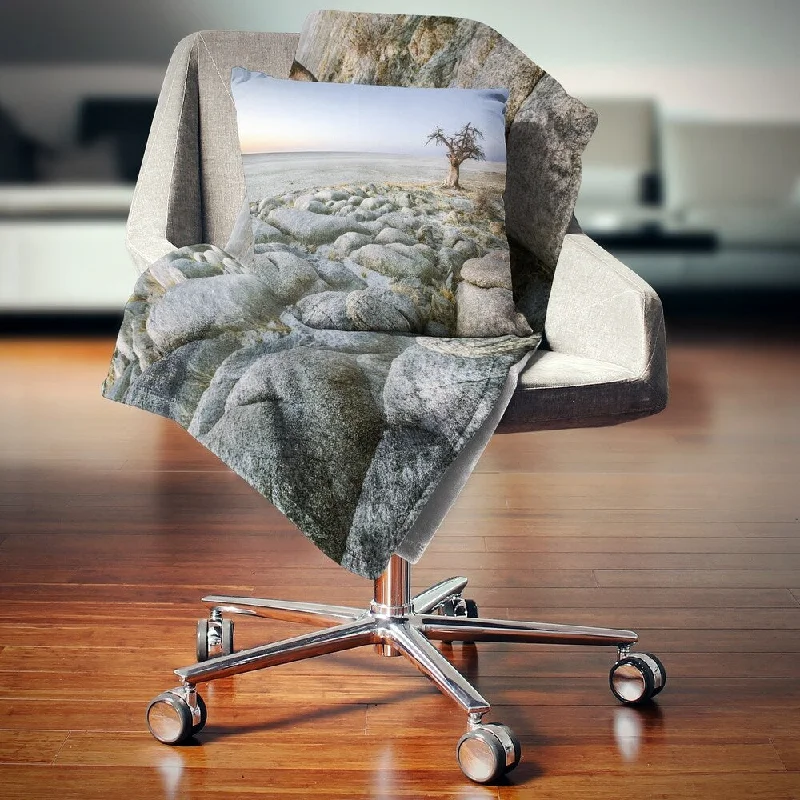 Cotton blankets for breathability and a lightweight feelCotton blankets for breathability and a lightweight feelDesignart 'Baobab Tree on Rocky Terrain' Landscape Fleece Throw Blanket