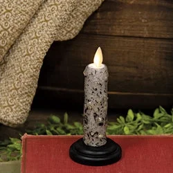 Bed skirts with a flannel material for a cozy winter optionSilicone Dipped Chris Gray Timer Taper on Black Wooden Base